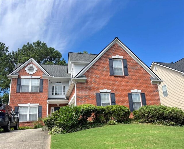 view of front of home with a front lawn