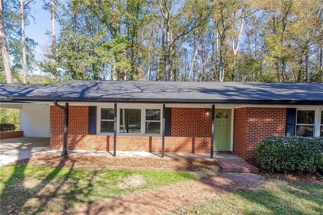 ranch-style home with a carport