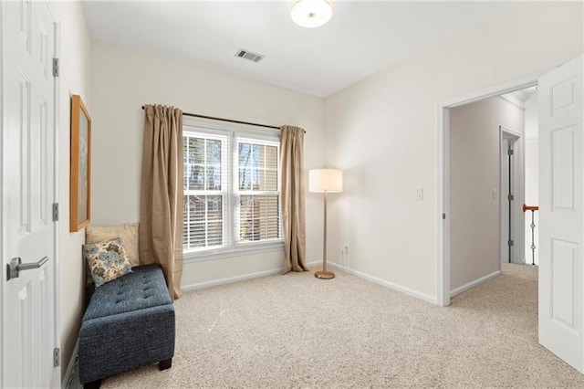 living area with carpet floors and baseboards