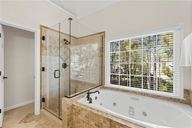 full bath with a stall shower and a whirlpool tub