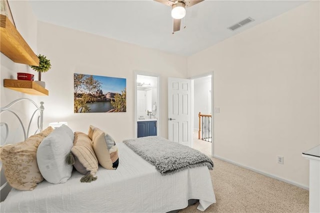 bedroom featuring carpet floors, baseboards, ceiling fan, and connected bathroom