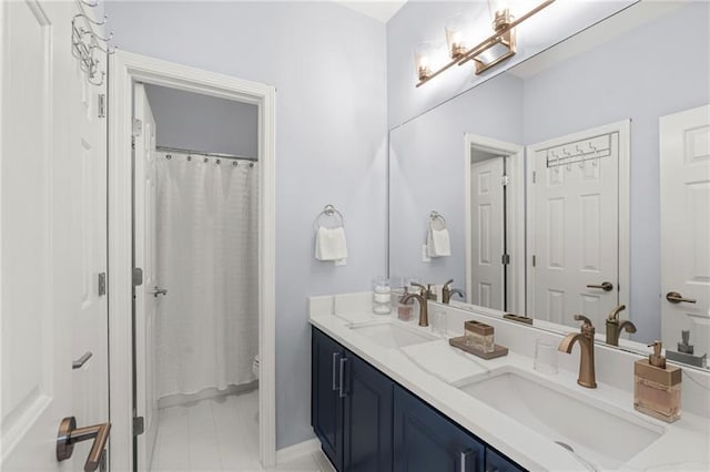 full bath with double vanity, toilet, and tile patterned floors