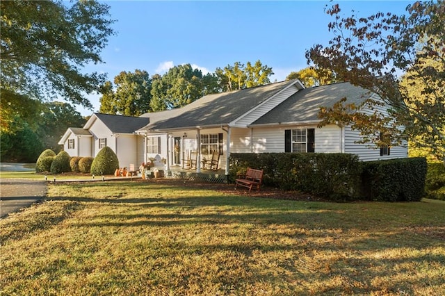 ranch-style house featuring a front lawn