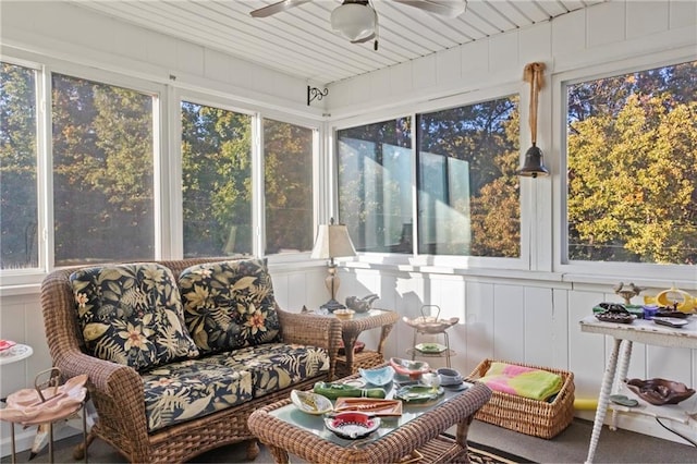 sunroom featuring a ceiling fan