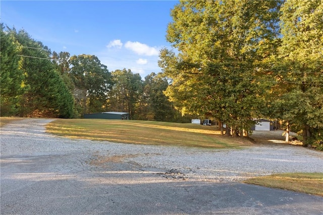 view of road featuring gravel driveway