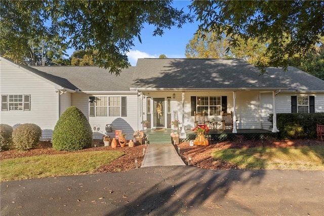 single story home featuring covered porch