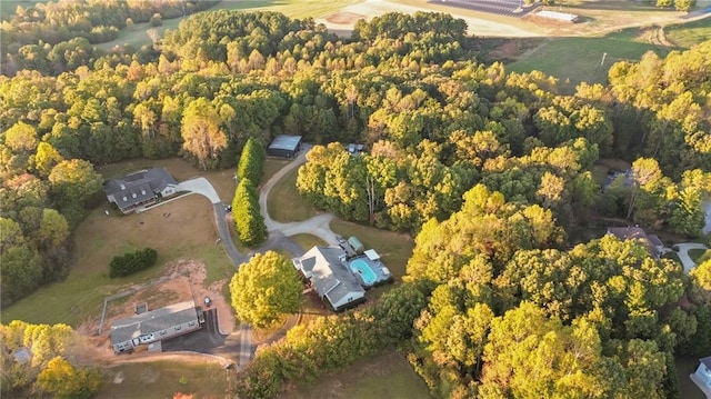 birds eye view of property with a wooded view