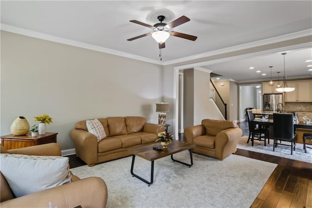 3920 Baverton Dr, Suwanee, GA 30024 - living room featuring dark wood finished floors, stairs, ceiling fan, ornamental molding, and baseboards