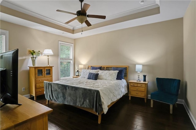 3920 Baverton Dr, Suwanee, GA 30024 - bedroom featuring a tray ceiling, dark wood-style flooring, baseboards, and a ceiling fan