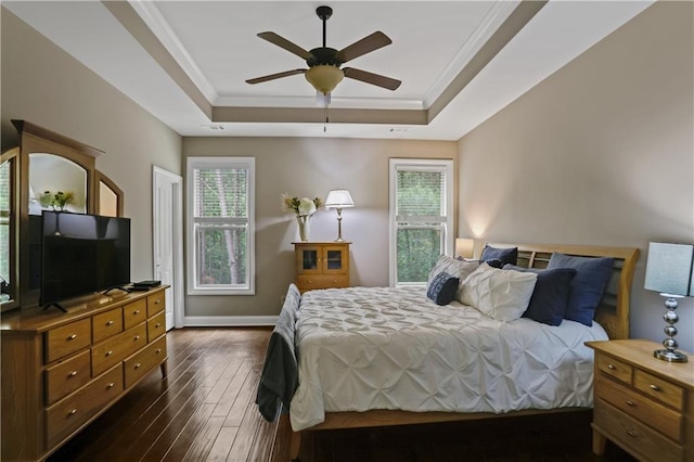 3920 Baverton Dr, Suwanee, GA 30024 - bedroom with a raised ceiling, dark wood-type flooring, baseboards, ceiling fan, and crown molding