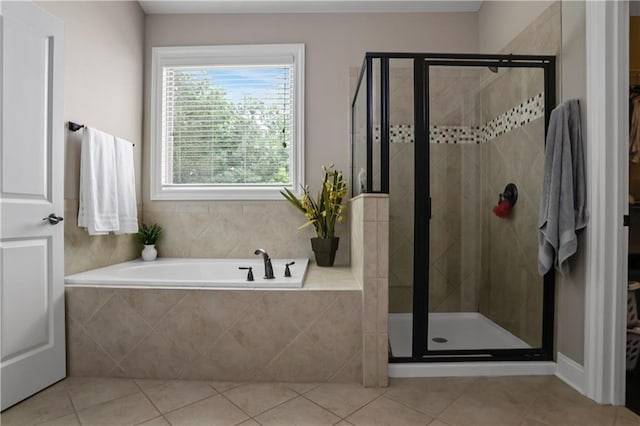 3920 Baverton Dr, Suwanee, GA 30024 - bathroom featuring a shower stall, a garden tub, and tile patterned floors