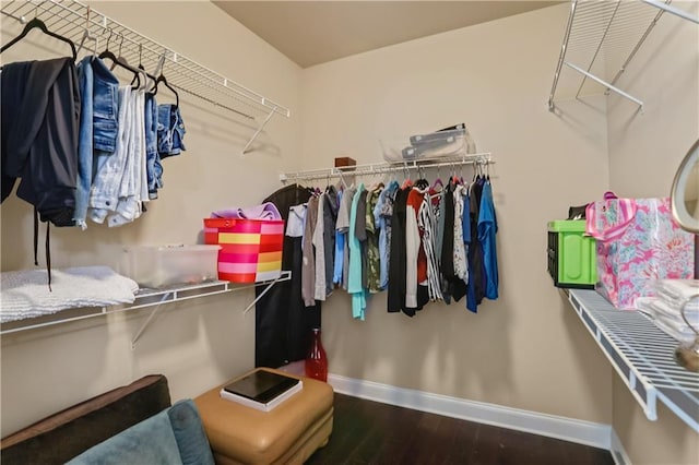 3920 Baverton Dr, Suwanee, GA 30024 - walk in closet featuring wood finished floors