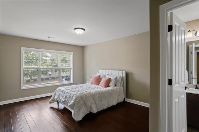 3920 Baverton Dr, Suwanee, GA 30024 - bedroom featuring baseboards, dark wood-style floors, and a sink