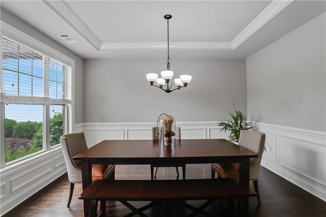 3920 Baverton Dr, Suwanee, GA 30024 - dining space with a tray ceiling, a chandelier, dark wood finished floors, a wainscoted wall, and a decorative wall