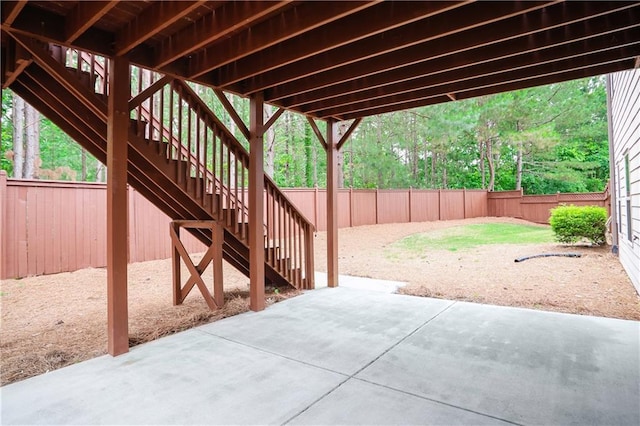 3920 Baverton Dr, Suwanee, GA 30024 - fenced backyard featuring a patio and stairs