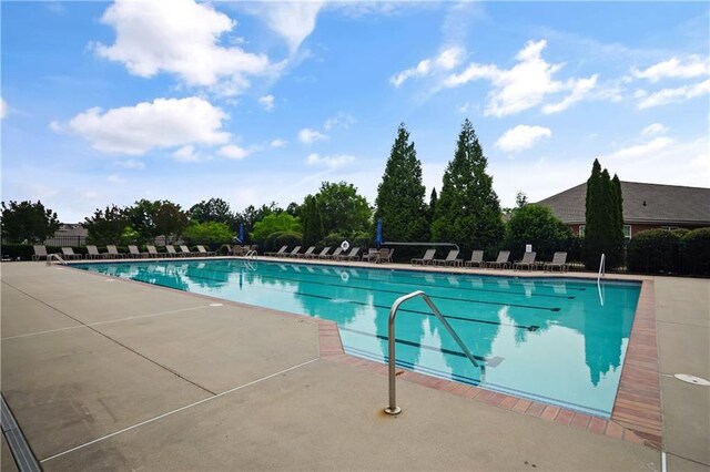3920 Baverton Dr, Suwanee, GA 30024 - community pool featuring a patio