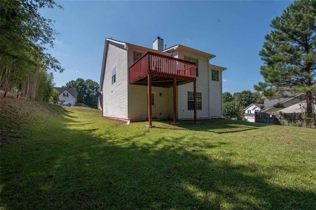 back of house with a lawn