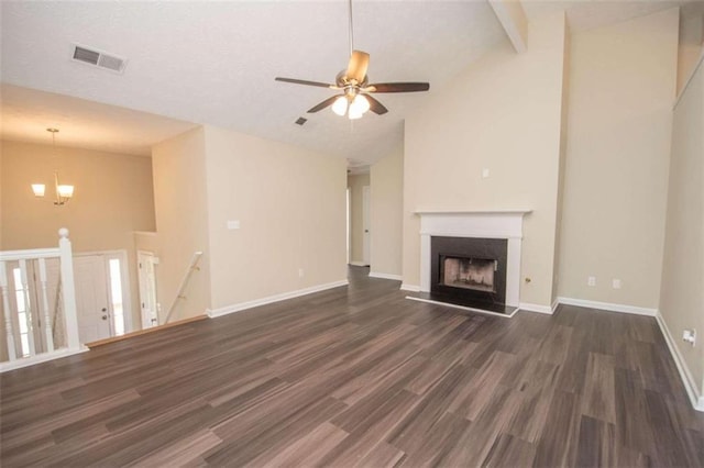 unfurnished living room with ceiling fan with notable chandelier, beamed ceiling, dark wood-type flooring, and high vaulted ceiling