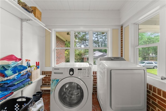 laundry area with washer and dryer and healthy amount of natural light