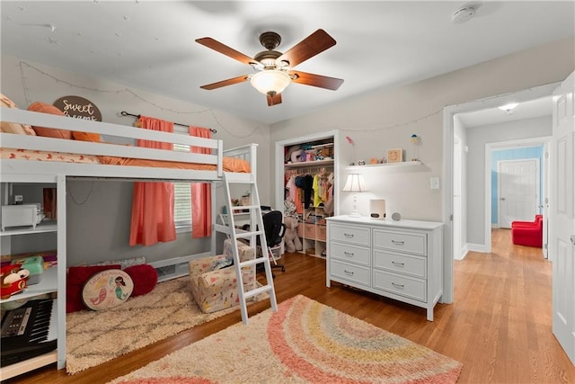 bedroom featuring light wood-style flooring and ceiling fan