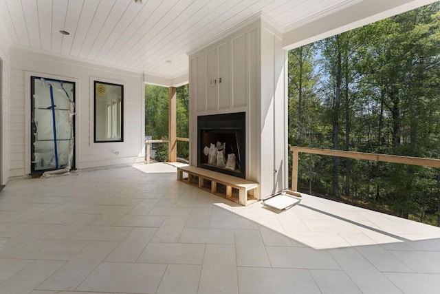 view of patio / terrace featuring exterior fireplace