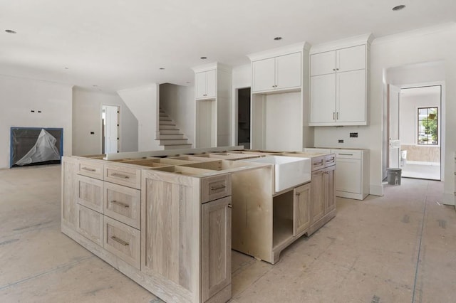 kitchen featuring a large island and white cabinetry