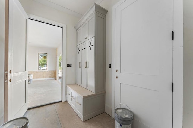 mudroom with concrete floors