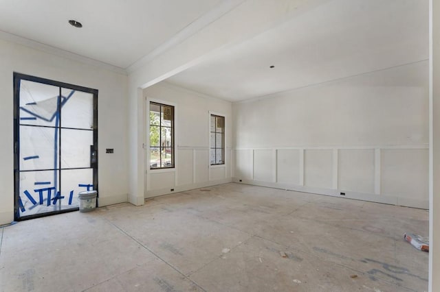 unfurnished room with crown molding