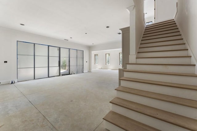 stairs with concrete floors
