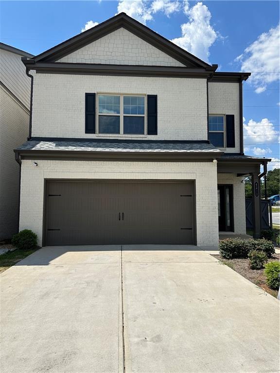 front of property with a garage