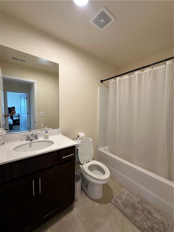 full bathroom featuring vanity, shower / tub combo, tile patterned flooring, and toilet