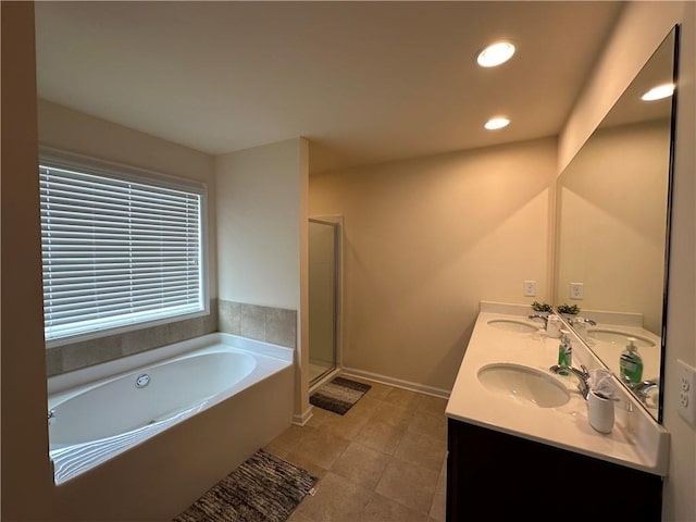 bathroom featuring vanity, separate shower and tub, and tile patterned flooring