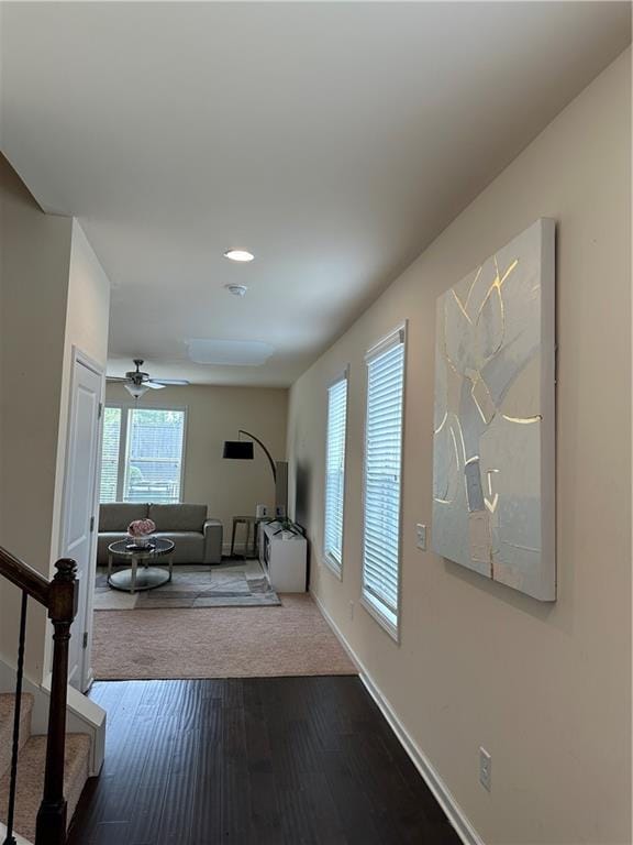 hallway with hardwood / wood-style floors