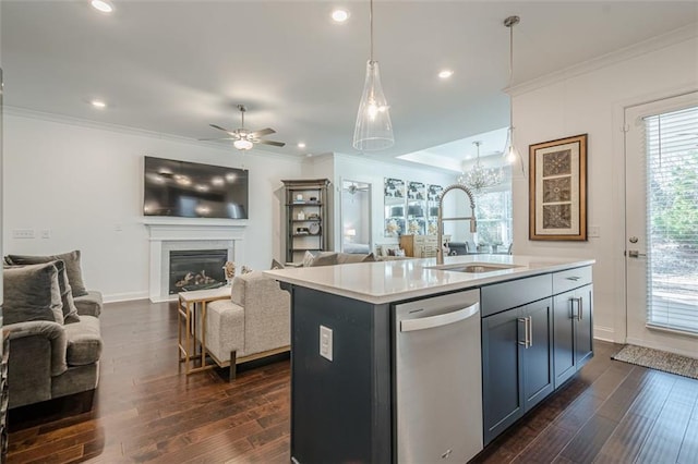 kitchen with a sink, dishwasher, ornamental molding, a glass covered fireplace, and dark wood-style flooring