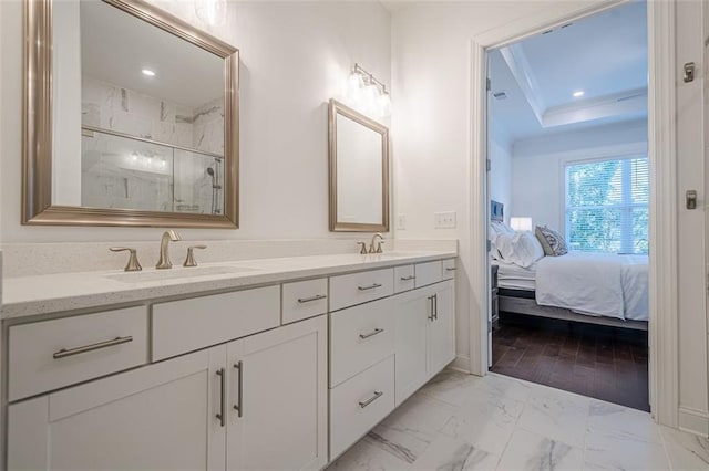 ensuite bathroom with ensuite bath, marble finish floor, a marble finish shower, and a sink