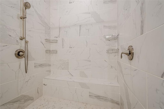 bathroom with tiled shower