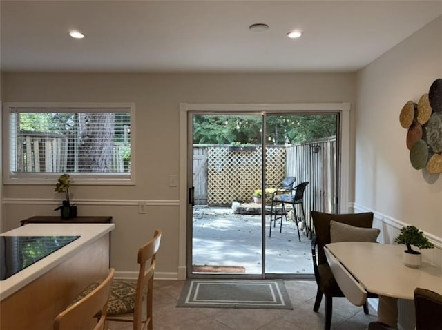 doorway to outside with tile patterned flooring and recessed lighting