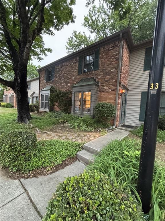 view of front of home with brick siding