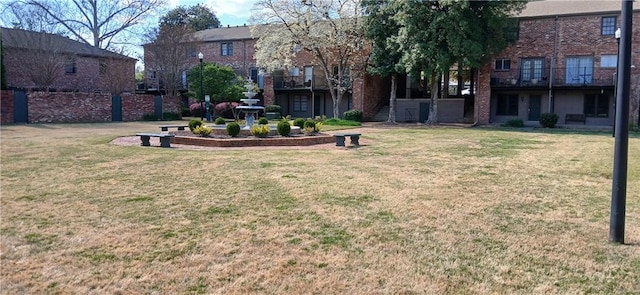 view of green lawn with stairs