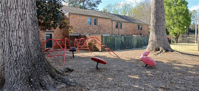 view of playground featuring fence