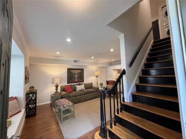 living area featuring stairs, wood finished floors, recessed lighting, ornamental molding, and baseboards