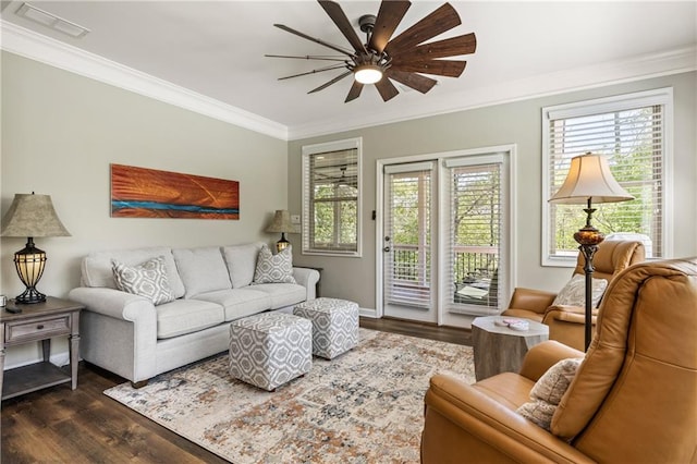 1695 Peyton Farm Dr, Alpharetta, GA 30004 - living area featuring dark wood-style flooring, crown molding, a ceiling fan, and healthy amount of natural light