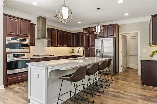 1695 Peyton Farm Dr, Alpharetta, GA 30004 - kitchen with appliances with stainless steel finishes, wall chimney exhaust hood, a sink, backsplash, and hanging light fixtures