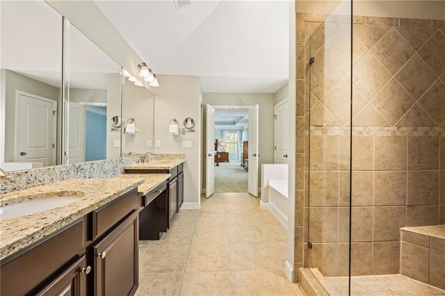 1695 Peyton Farm Dr, Alpharetta, GA 30004 - bathroom featuring double vanity, tiled shower, baseboards, and tile patterned floors