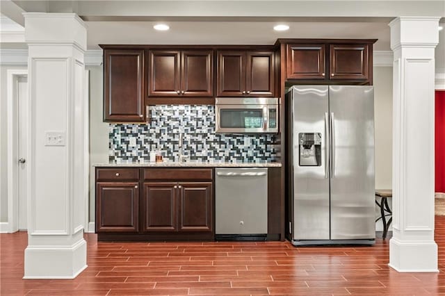 1695 Peyton Farm Dr, Alpharetta, GA 30004 - kitchen with stainless steel appliances, decorative columns, wood finished floors, dark brown cabinets, and recessed lighting