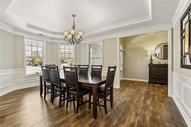 1695 Peyton Farm Dr, Alpharetta, GA 30004 - dining space featuring a chandelier, a raised ceiling, dark wood-style flooring, crown molding, and a wainscoted wall