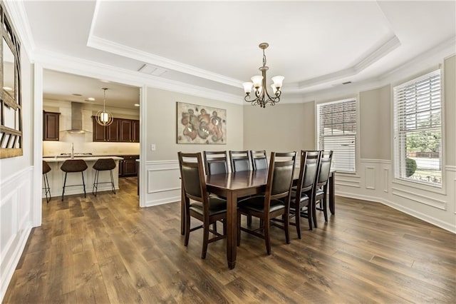 1695 Peyton Farm Dr, Alpharetta, GA 30004 - dining area featuring a raised ceiling, a decorative wall, a chandelier, dark wood-style flooring, and crown molding