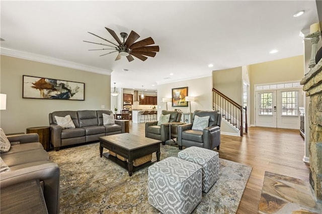 1695 Peyton Farm Dr, Alpharetta, GA 30004 - living area featuring stairway, ceiling fan, wood finished floors, ornamental molding, and recessed lighting