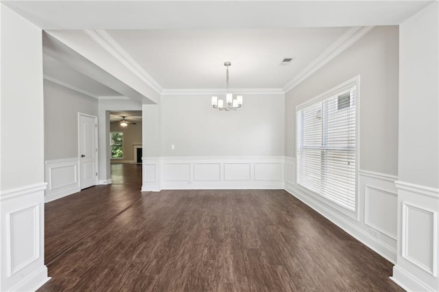 unfurnished dining area featuring a chandelier, plenty of natural light, and dark wood-style floors