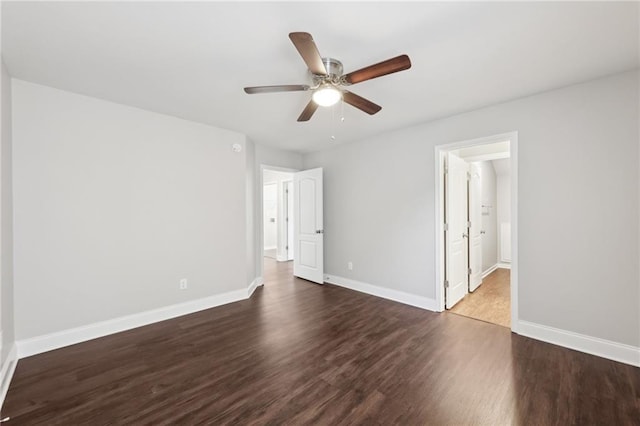 interior space featuring baseboards, wood finished floors, and ceiling fan